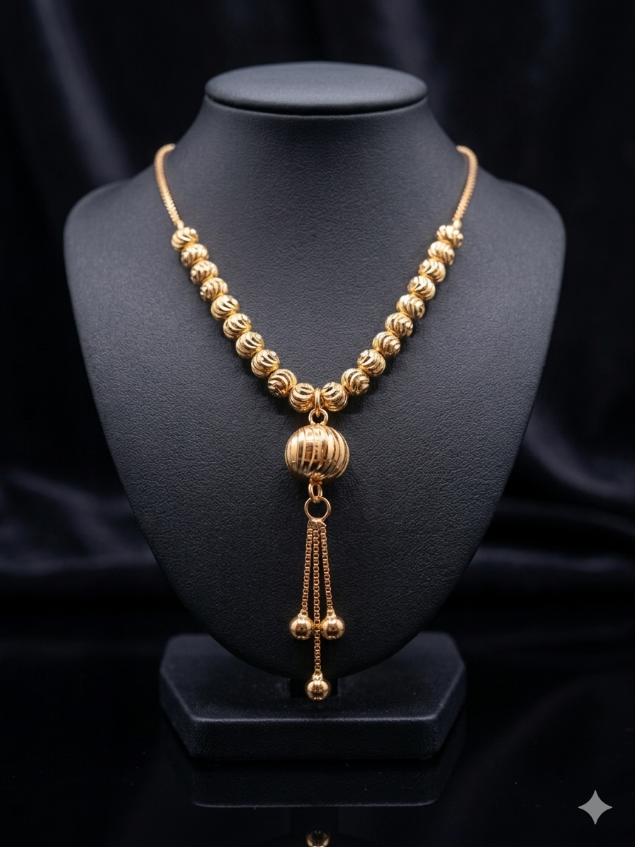Golden Textured Sphere Tassel Necklace